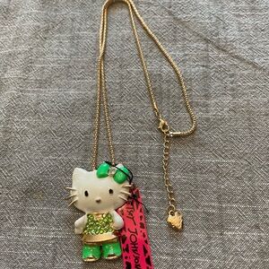 Gold Hello Kitty Necklace with Green Accents